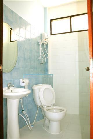 a bathroom with a toilet and a sink at Naga Peak Resort in Ao Nang Beach