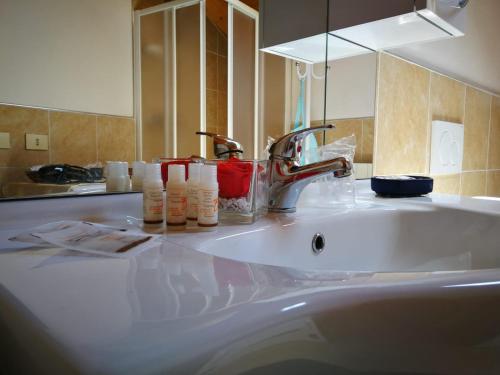 a bathroom counter with a sink and a faucet at Il Planetario in Verbania