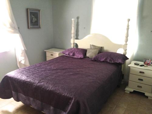 Katil atau katil-katil dalam bilik di Chatham Cottage