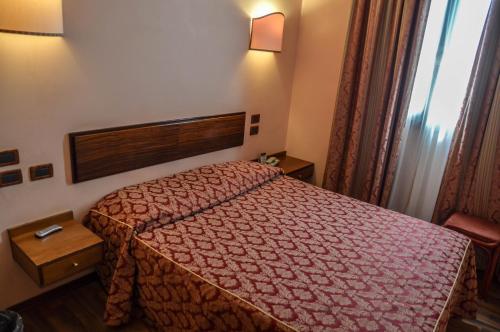 Postel nebo postele na pokoji v ubytování Hotel Le Boulevard
