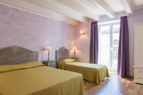 Postel nebo postele na pokoji v ubytování B&B Apollo