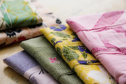 a pile of colorful cushions sitting on a table at Resorpia Kumihama in Kyotango