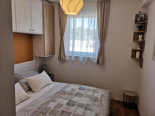 Posteľ alebo postele v izbe v ubytovaní Natalija