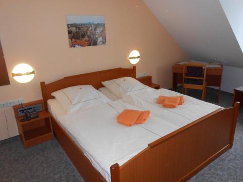 Postel nebo postele na pokoji v ubytování Goldener Engel /Pension