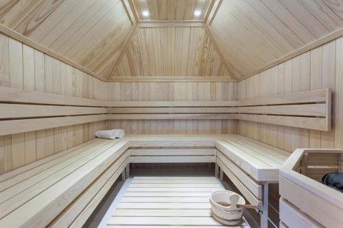a sauna with wooden walls and a ceiling at Vila Barović and Spa in Zlatibor
