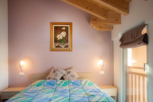 Katil atau katil-katil dalam bilik di b&b Casa Tavernaro