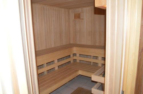 a small sauna with wooden panels at Penzion 409 in Horní Branná