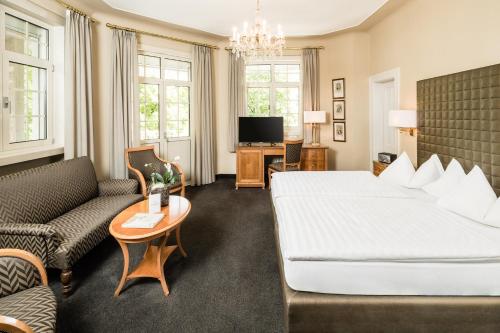 Postel nebo postele na pokoji v ubytování Classic Hotel Meranerhof