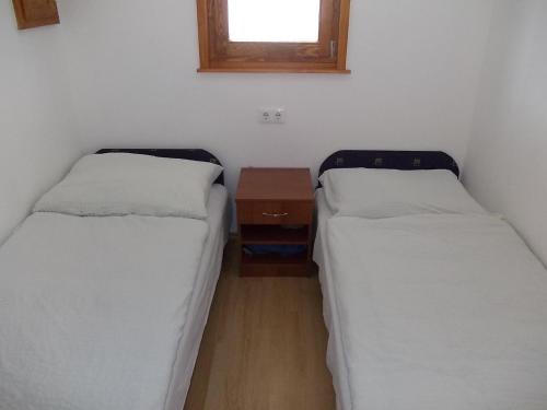 Una cama o camas en una habitación de Puszta Hotel