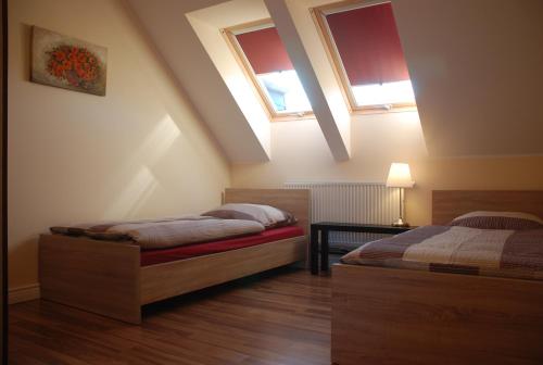 Cama o camas de una habitación en Apartamenty ANNA