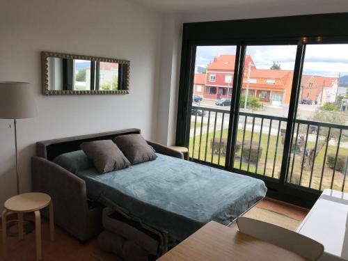 Ένα ή περισσότερα κρεβάτια σε δωμάτιο στο Apartamento en la Isla
