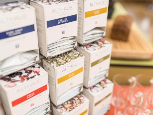 a stack of boxes of nuts on a table at viavelo hotel am Seepark in Freiburg im Breisgau