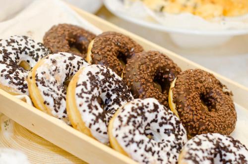 a tray of donuts with chocolate and marshmallows at Hotel Royal Plaza in Rimini