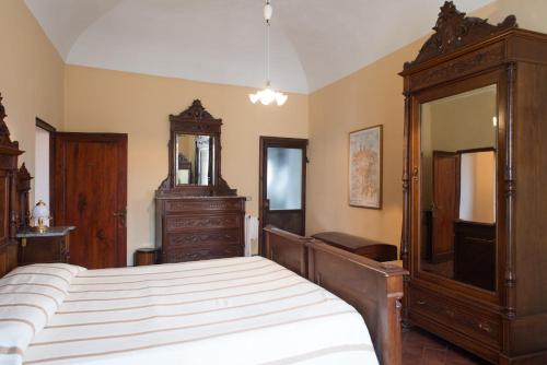 Letto o letti in una camera di Residenza D'Epoca Palazzo Buonaccorsi