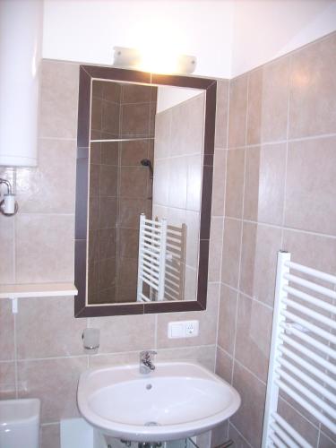 a bathroom with a sink and a mirror at Villa Toscana in Steyr