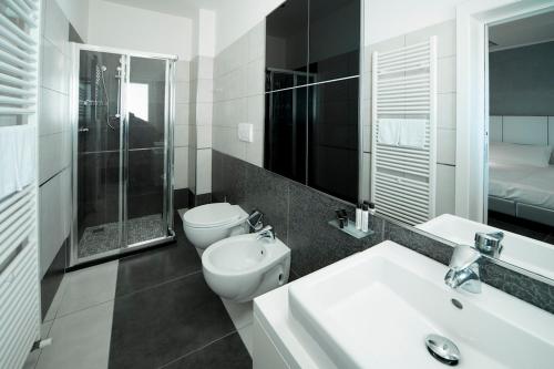 A bathroom at Atmosphere Suite Hotel