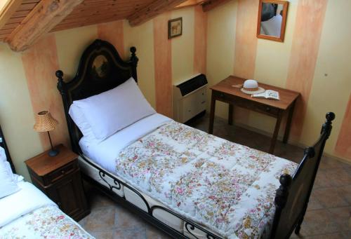 Ένα ή περισσότερα κρεβάτια σε δωμάτιο στο B&B Locanda dei Tigli
