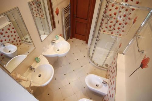 an overhead view of a bathroom with two sinks and a shower at Green Garden Hotel in Prague