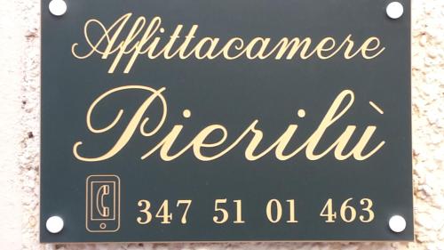 a sign for the entrance to a restaurant at B&B Pierilu' in Grosseto