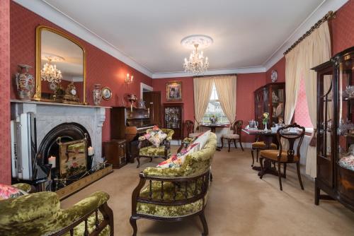 a living room filled with furniture and a fireplace at Friars Quarter House B&B in Ballinrobe