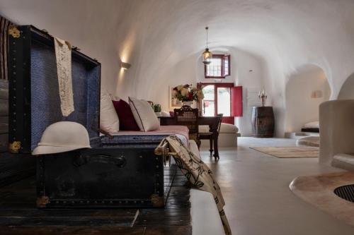 a living room with a couch and a table at Abelis Canava Luxury Suites in Vóthon