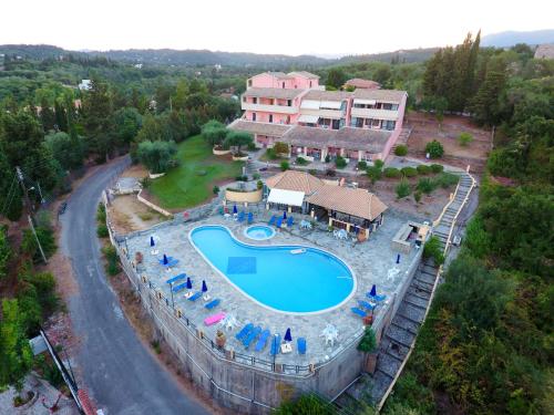 an aerial view of a resort with a swimming pool at Penelope Apartment Hotel in Dassia