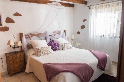 מיטה או מיטות בחדר ב-Casa Maida