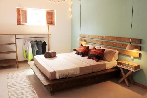 En eller flere senge i et værelse på Casa Pau