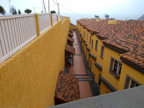 an overhead view of a row of yellow buildings at PLAYA Y MONTAÑA: NATURALEZA Y ARMONÍA in La Laguna