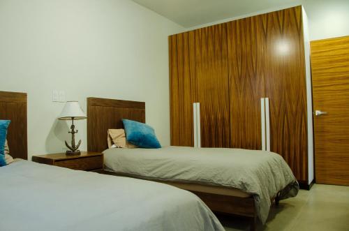 Posteľ alebo postele v izbe v ubytovaní El Refugio