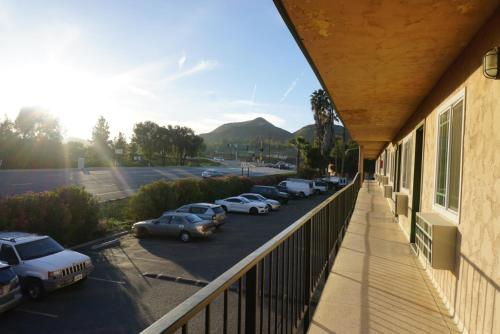 a balcony with cars parked in a parking lot at Americas Best Value Inn Thousand Oaks in Thousand Oaks