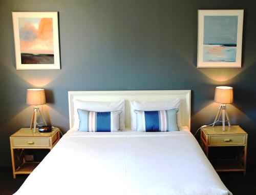 Ένα ή περισσότερα κρεβάτια σε δωμάτιο στο Hamilton Motor Inn