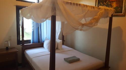 Ένα ή περισσότερα κρεβάτια σε δωμάτιο στο Aman Gati Hotel Lakey