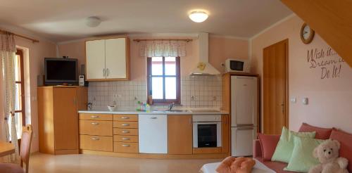 a small kitchen with a sink and a counter at PLANINCA -hiša z razgledom in Šmarje pri Jelšah