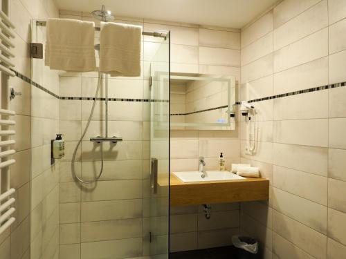 Ванная комната в Wein Erlebnis Hotel Maimühle