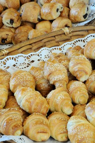 a bunch of pastries on display in a bakery at Country Lodge Hotel & Resort Beirut in Beirut