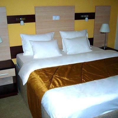 Postel nebo postele na pokoji v ubytování Hotel Leotar