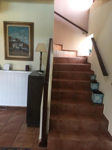 a staircase in a home with a stair case at Rafina great feeling villa in Rafina
