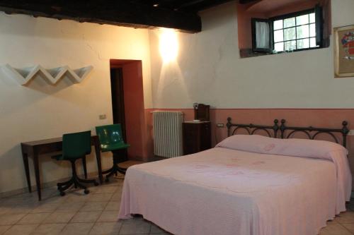 Säng eller sängar i ett rum på La Cascianella