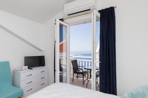 เตียงในห้องที่ Apartments Lea