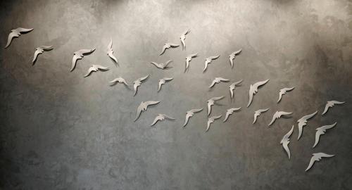 a flock of seagulls flying through the air at Tomtom Suites in Istanbul