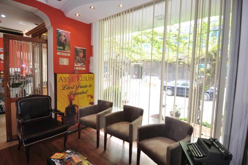 a waiting room with chairs and a window at Mini Hotel in Izmir