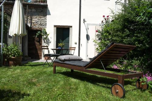 a hammock sitting in the grass in a yard at Il Vecchio Comune in Santa Sofia