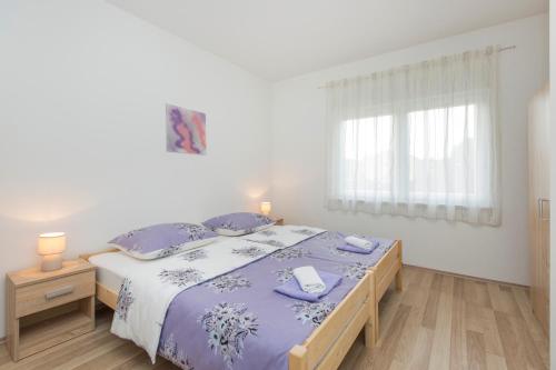 A bed or beds in a room at Brankica apartaments