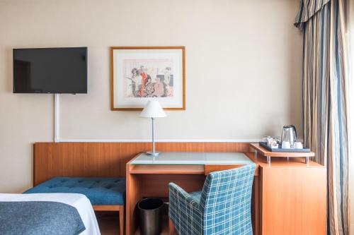 Ένα ή περισσότερα κρεβάτια σε δωμάτιο στο Up Rooms Vic Hotel