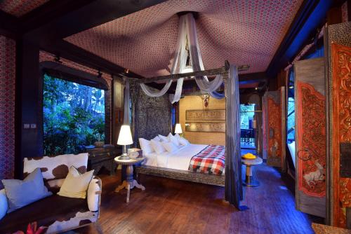 Кровать или кровати в номере Capella Ubud, Bali