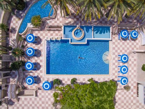 an overhead view of a pool at a resort at Mediteran Hotel & Resort in Budva