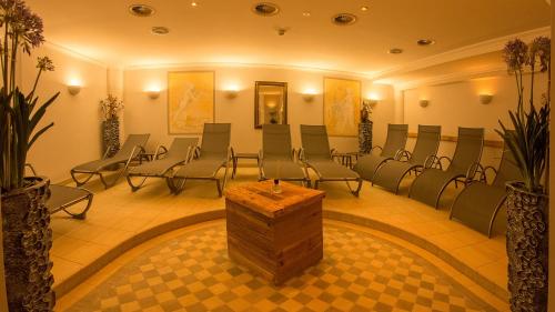 a conference room with chairs and a table in the middle at Wohlfühlhotel Schiestl in Fügen