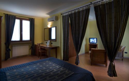 Postel nebo postele na pokoji v ubytování Il Casale Corte Rossa