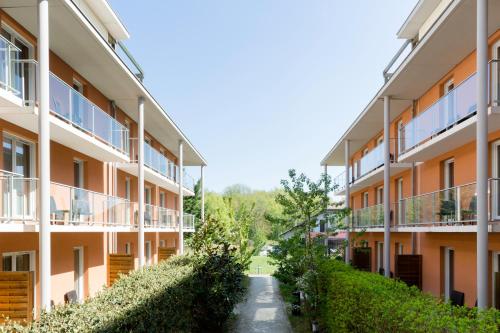 an image of an apartment building with a pathway at Best Western Park Hotel Geneve-Thoiry in Thoiry
